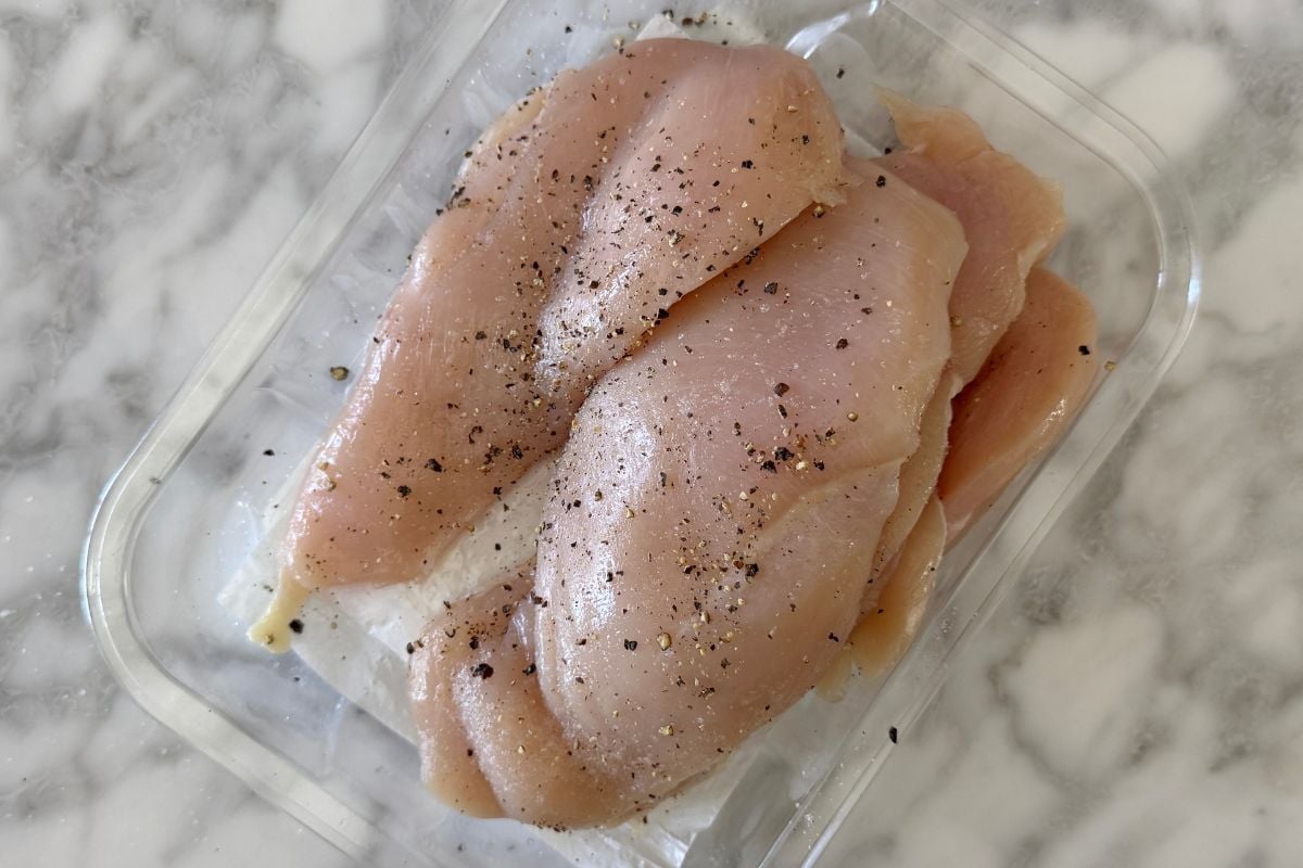 Chicken seasoned with salt and pepper.