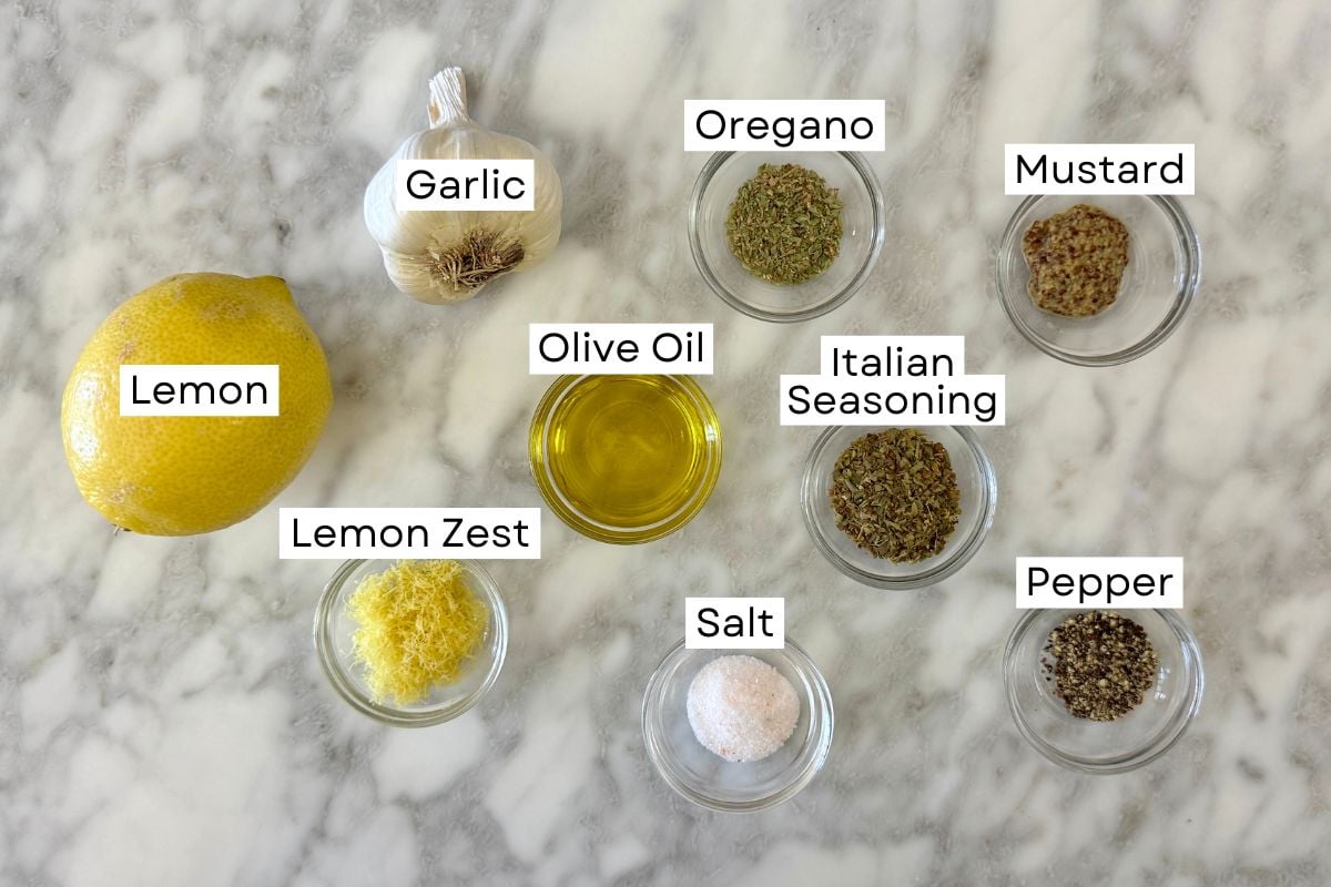 Ingredients for lemon garlic chicken marinade in bowls.