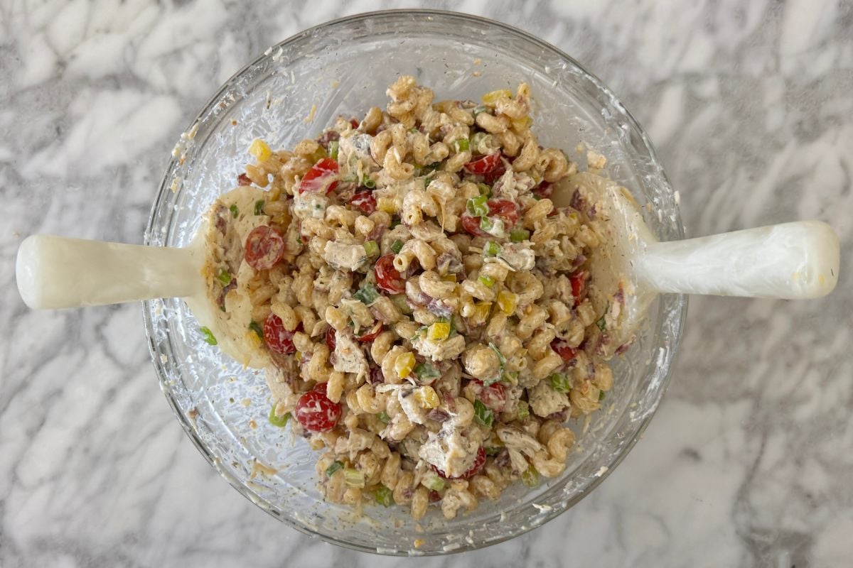 Tossed chicken bacon ranch pasta salad in a bowl.