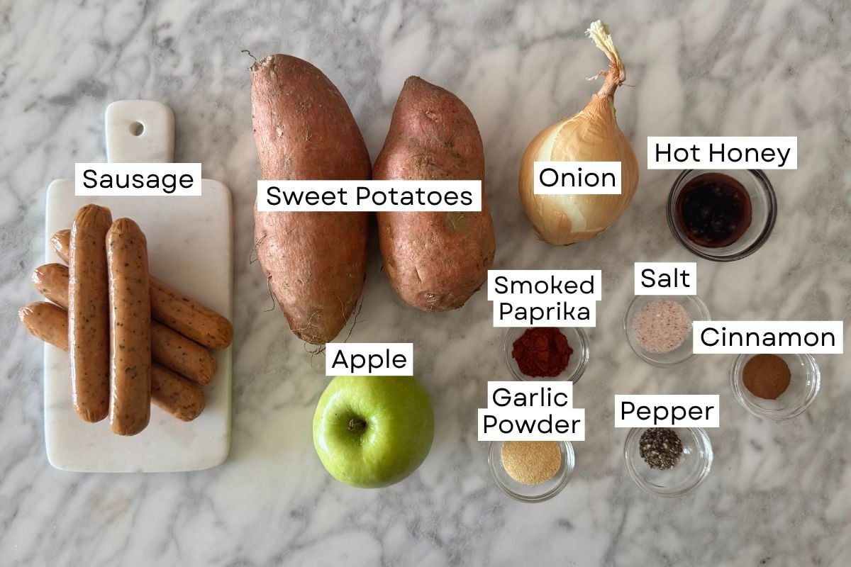 Ingredients for sheet pan sausage and sweet potatoes in bowls.