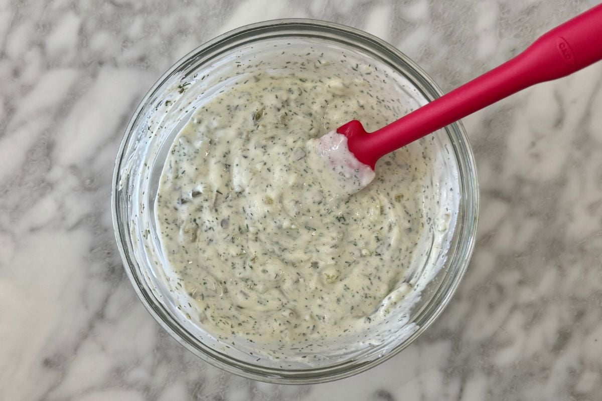 Mixed dill pickle dip in a bowl | Healthy Foodie Girl Mixed dill pickle dip in a bowl.