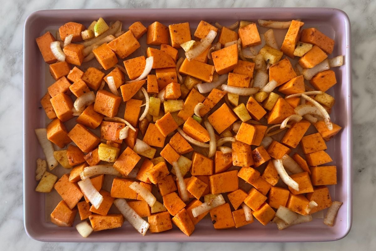 Roasted sweet potatoes and apples on sheet pan.
