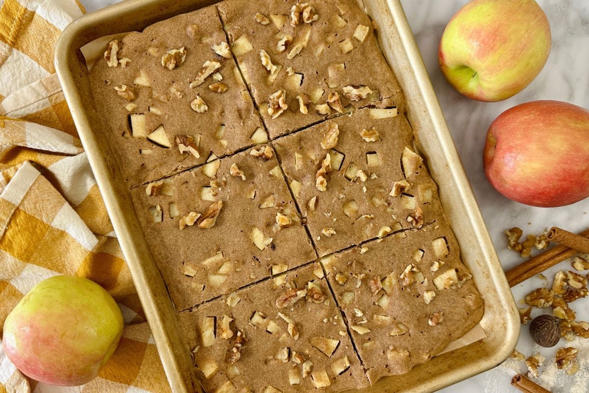 Baked apple cinnamon sheet pan pancakes on a sheet pan.