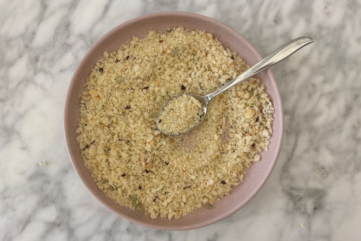 Breadcrumb coating for pizza meatballs in bowl.
