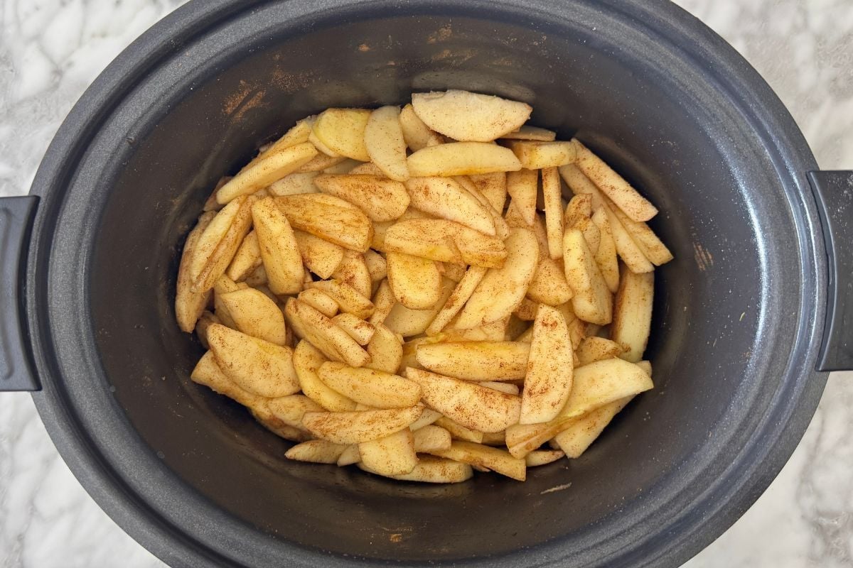 Coated cinnamon apples in slow cooker.