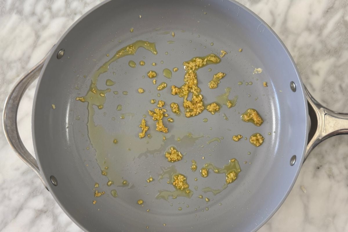 Cooked garlic in a pan | Healthy Foodie Girl Cooked garlic in a pan.
