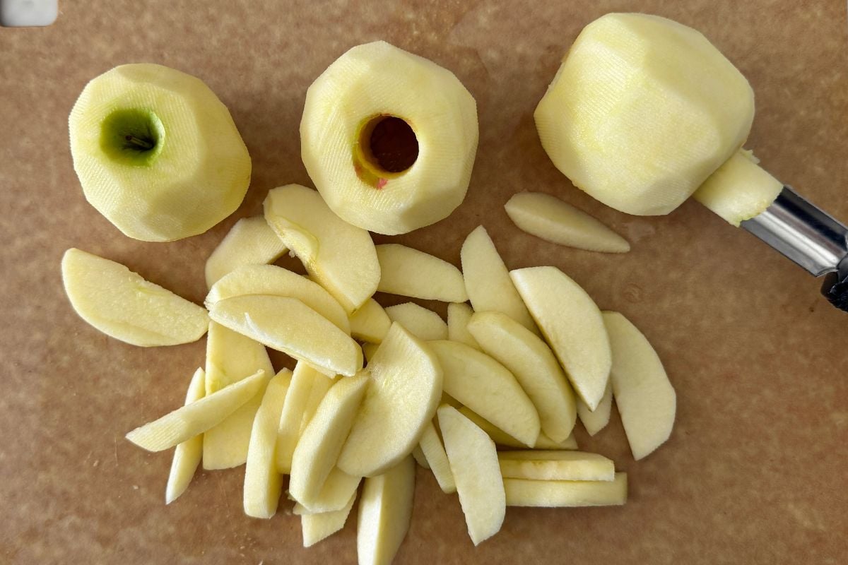 Peeled apples with the cores removed.