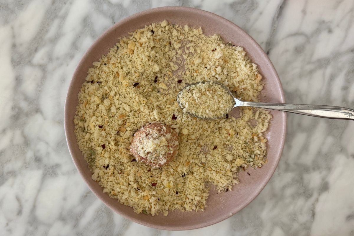 Pizza meatball rolled in breadcrumbs.