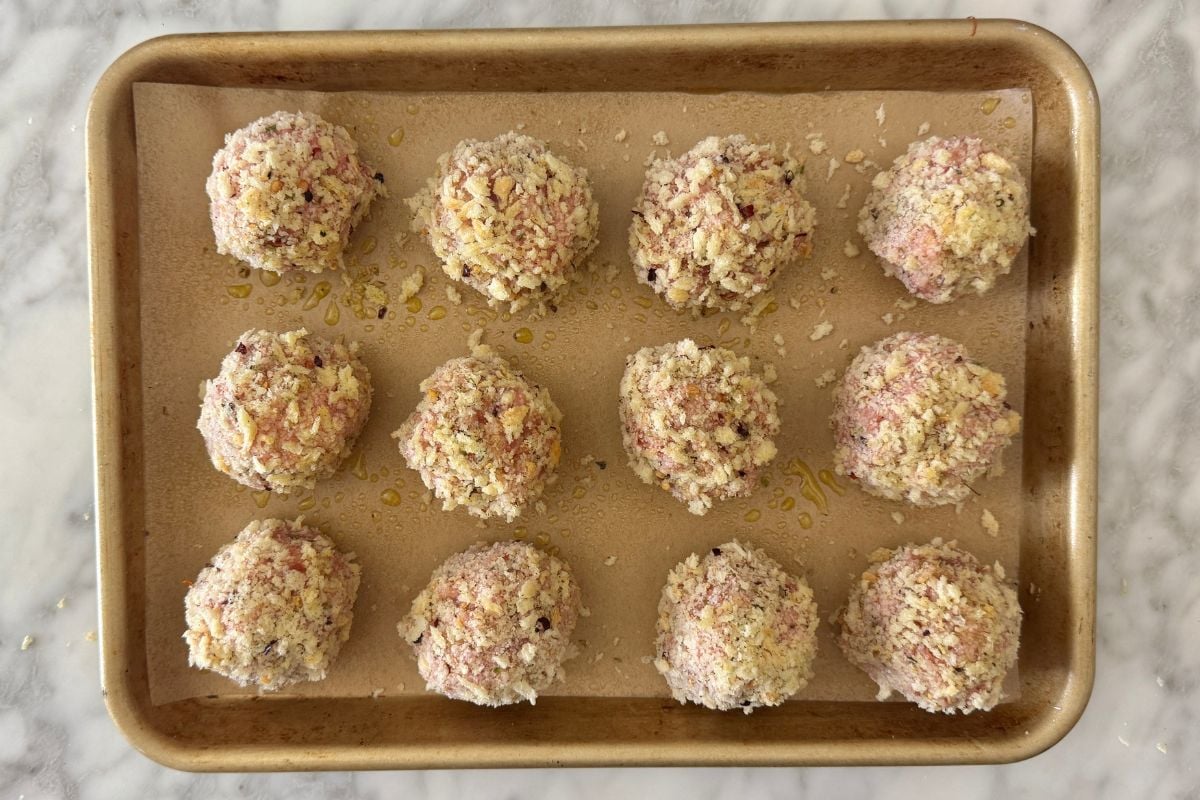 Pizza meatballs on a sheet pan.