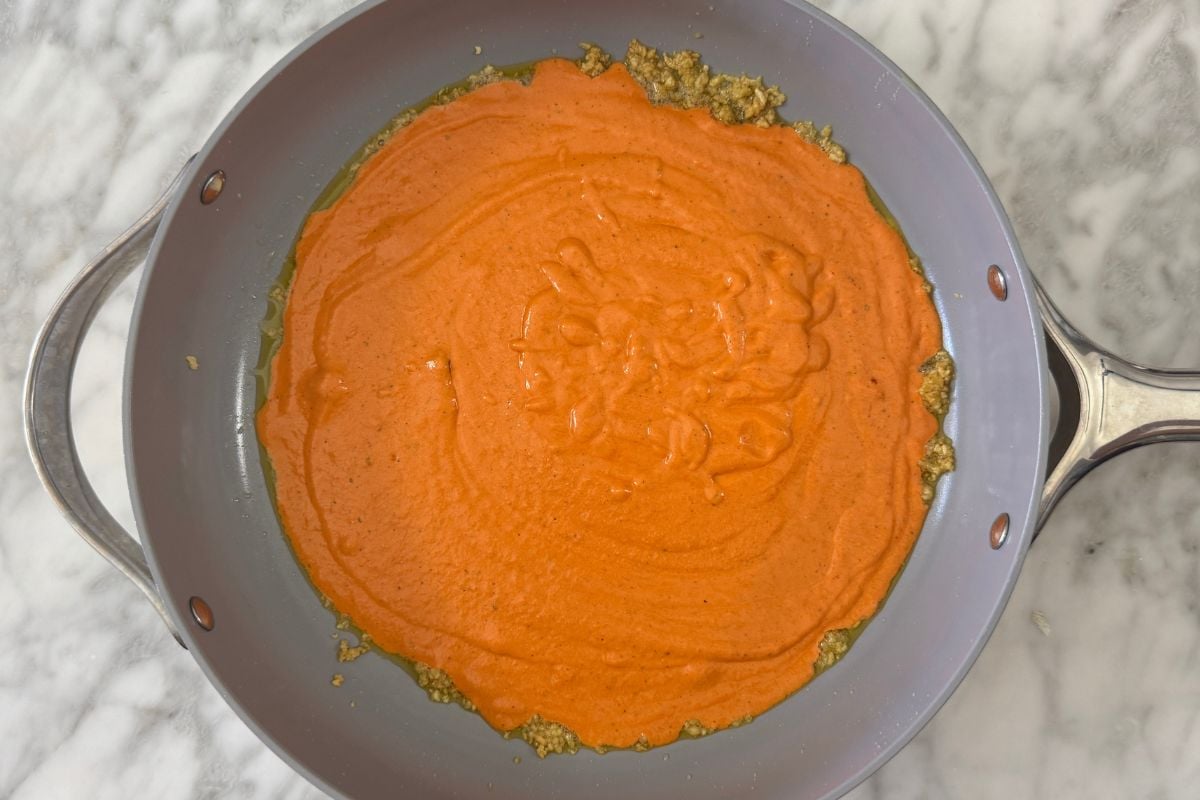 Roasted red pepper pasta sauce in pan | Healthy Foodie Girl Roasted red pepper pasta sauce in pan.