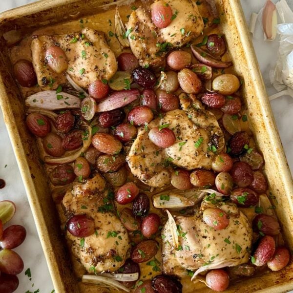 Sheet Pan Chicken with Grapes and Shallots baked on sheet pan.