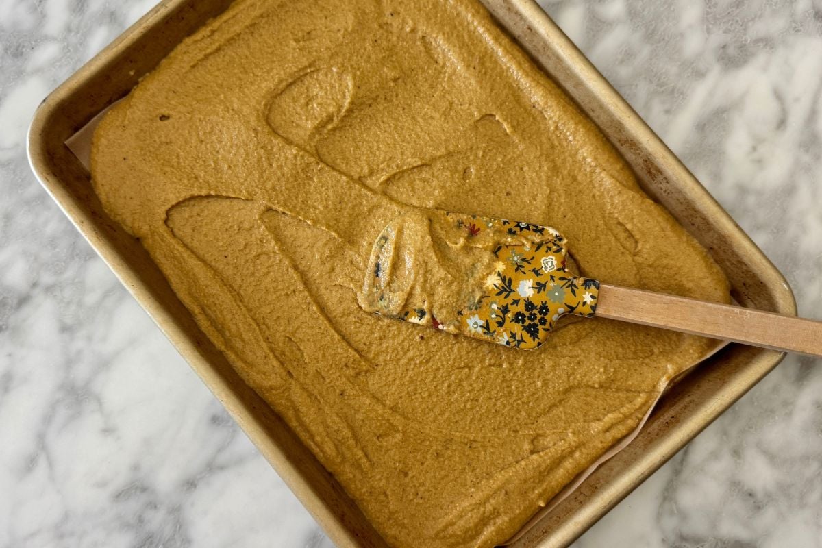 Spread pumpkin pancakes batter on sheet pan | Healthy Foodie Girl Spread pumpkin pancakes batter on sheet pan.