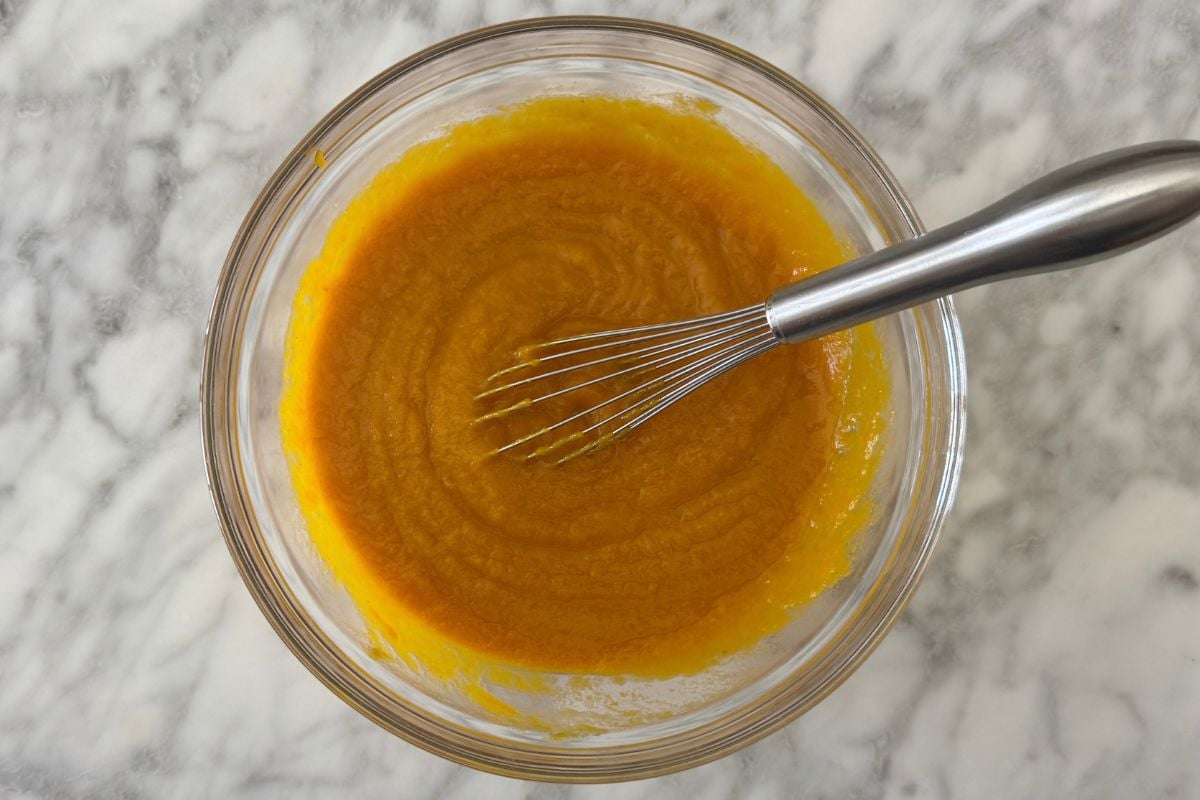 Wet ingredients for pumpkin muffins in bowl.
